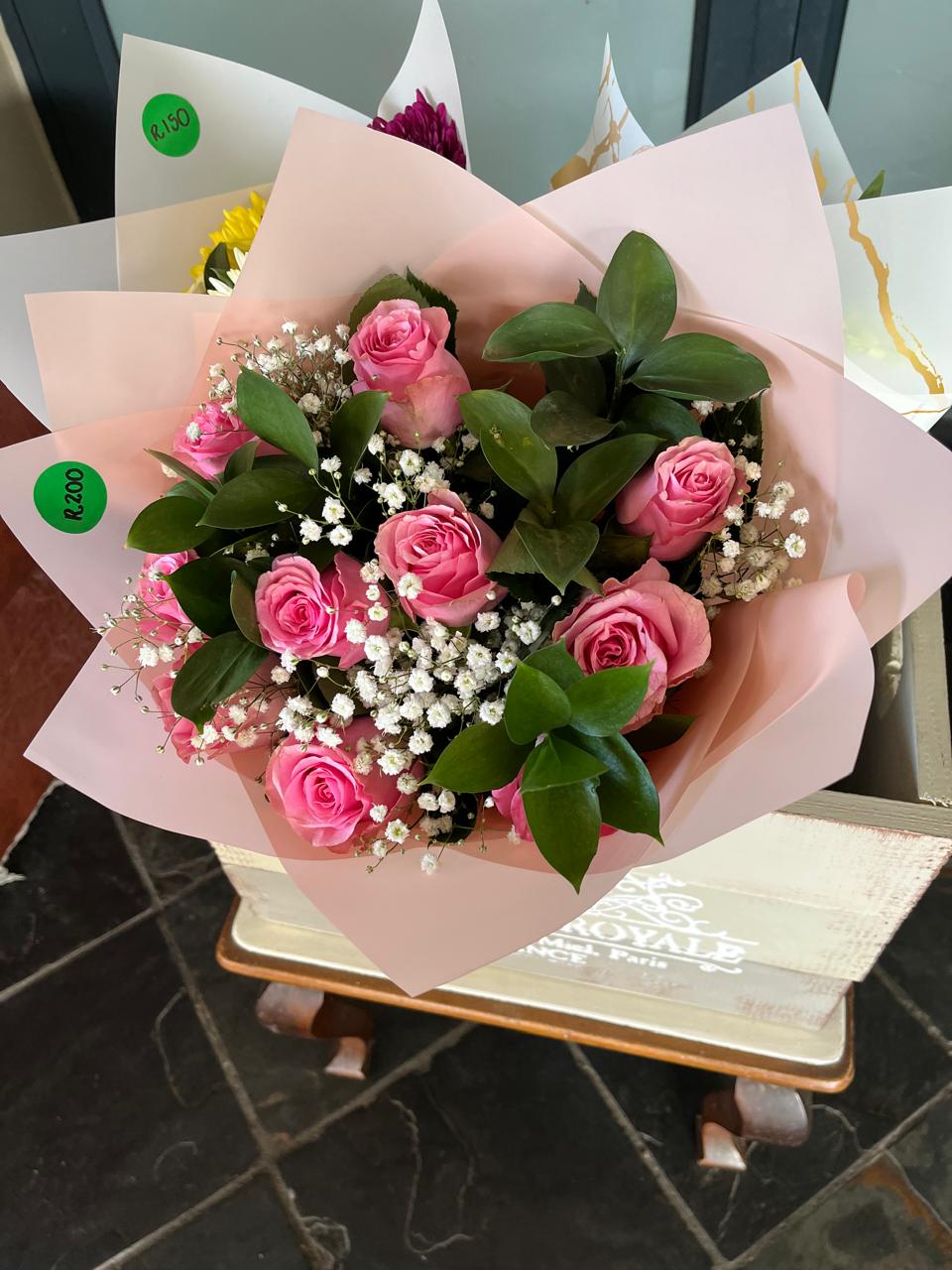 Pink rose bouquet wrapped for collection